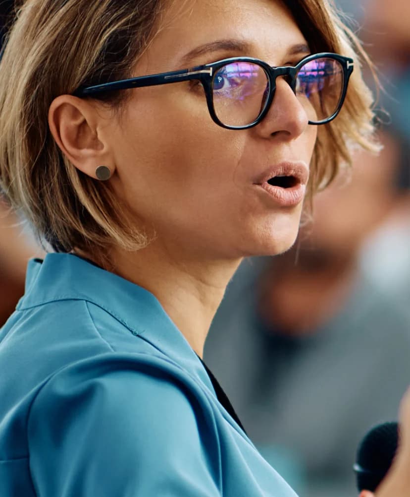 Business woman speaking to audience