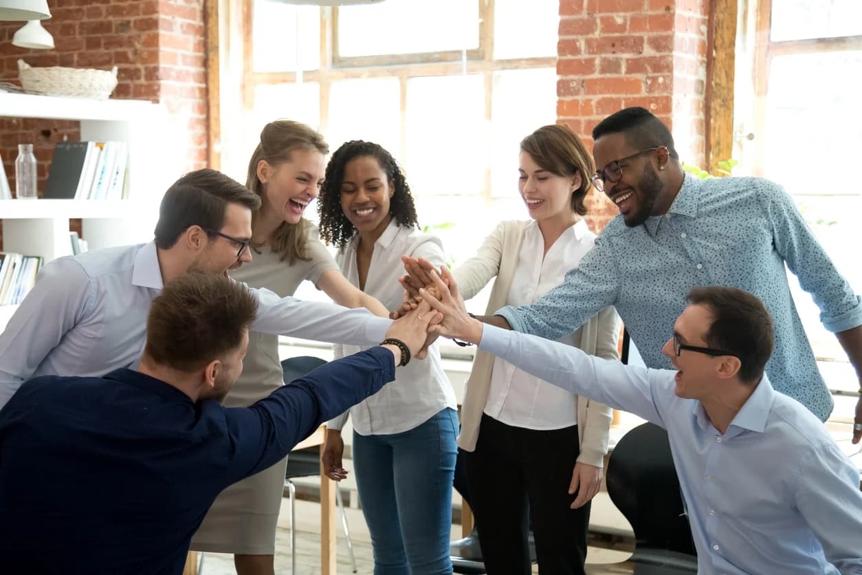 A high-performing legal team huddles in celebration after meeting its KPIs in 2022.