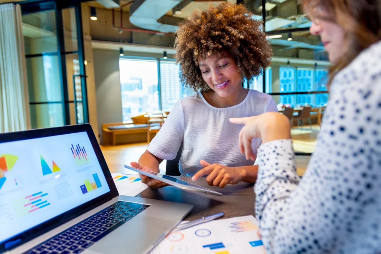A chief legal officer meets with an operations specialist to review some of her team’s legal budgeting trends.